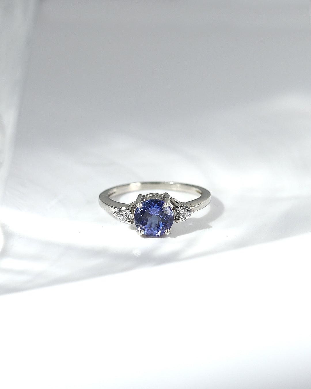 Classic Round Tanzanite and Moissanite Three stone ring