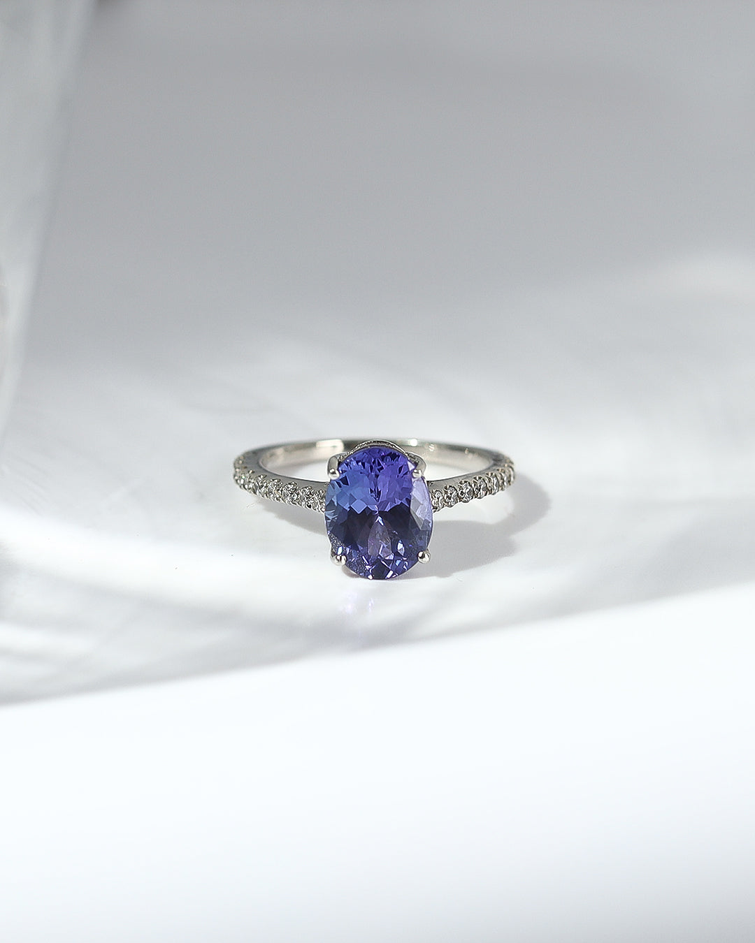 Sleek Shank Oval Cut Tanzanite Ring With Moissanite Accents