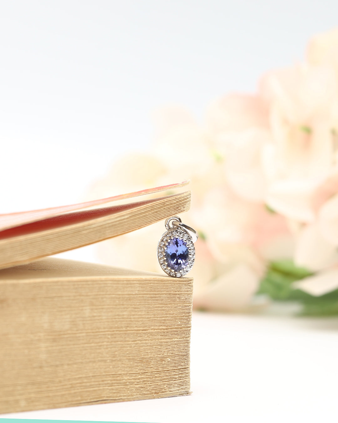 Oval Tanzanite Pendant with Floral Moissanite Halo