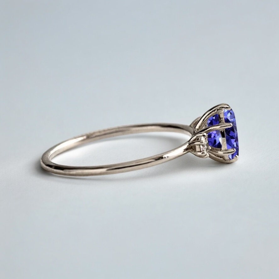 Classic Tanzanite and Diamond Three Stone Engagement Ring